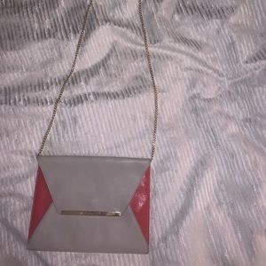 Gray Michael Kors purse with pink detail